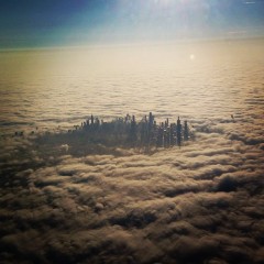 Chicago from airplane cloud city covered